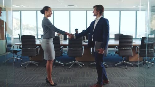 Handshake, partnership and business people in modern office for meeting