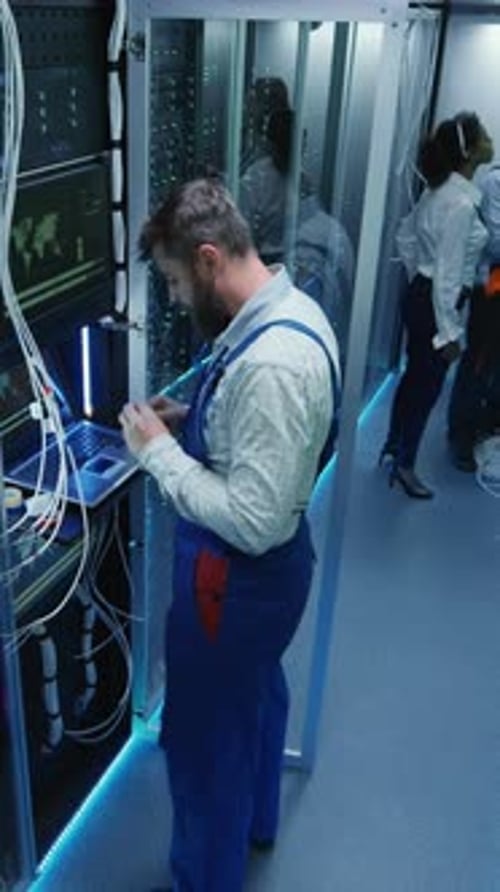 Top View People Work in the Data Center in the Server Room