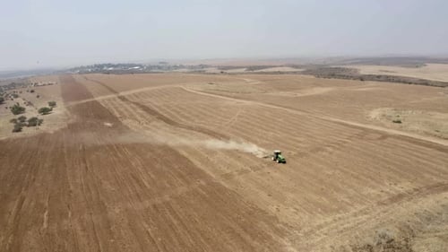 Tractor tilling in Judea Plain, Drone footage, Israel