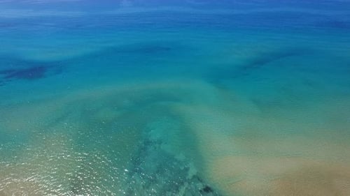 Mediterranean beach during summer with people in the water