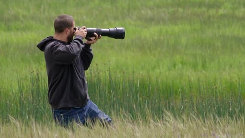 Male Landscape Photographer Preparing for His Shot and the Wildlife Environment National Park