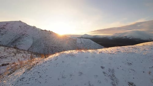 Breathtaking Drone View Captures Sunrise Over Yakutia's Snowy Mountains