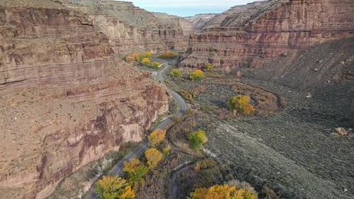 Aerial view through Nine Mile Canyon with road winding through