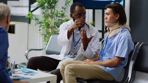 Doctor Consults Patient with Neck Brace in Hospital