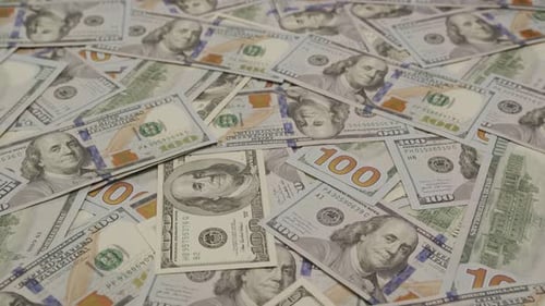 Money Cash in Random Order on Desk Close Up
