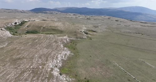 Sweeping Aerial View of Rolling Grassy Hills
