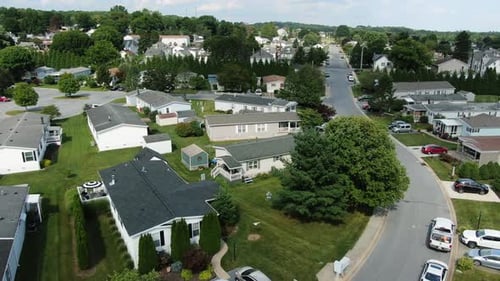 Aerial of single story trailer home mobile park homes in United States, village community neighborho