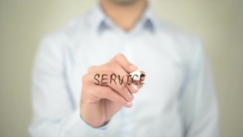 Person Writes Service on Transparent Surface