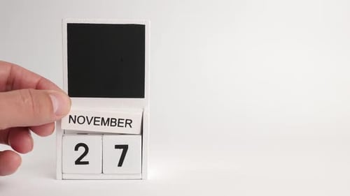 Hand Sets White Block Calendar to November 27th