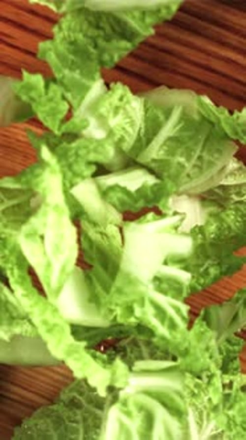 Pieces of Beijing Cabbage Fall on the Cutting Board Filmed is Slow Motion 1000 Fps