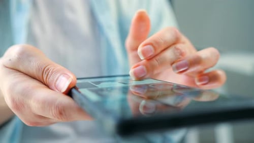 Woman Scrolling Through Social Media Feeds on Smartphone Close Up