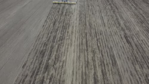 Blue tractor OA working on the field in Ukraine