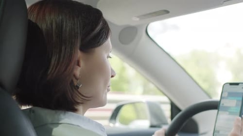 Woman Texting While Driving Distracted Driving Concept
