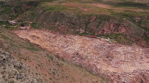 Aerial View of Maras Salt Mines Peru with Surrounding Mountains