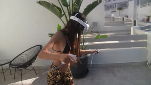 Woman Uses VR Headset on Sunny Patio