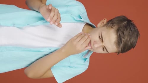 Vertical video of The sneezing boy. Patient.