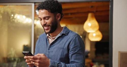 Young Adult Using Phone Indoors