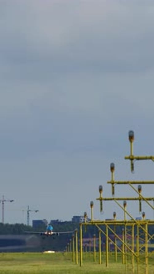 Airplane Ascending Into the Sky Above Illuminated Airport Runway