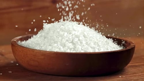 Salt Falls Into a Wooden Plate Filmed on a Highspeed Camera at 1000 Fps
