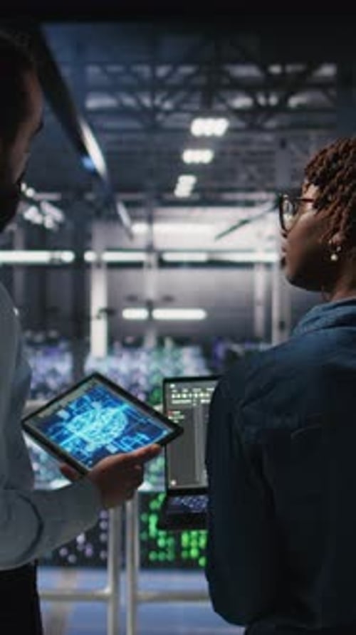 Vertical Video Server Farm Manager Overseeing Workers Doing AI Automatization