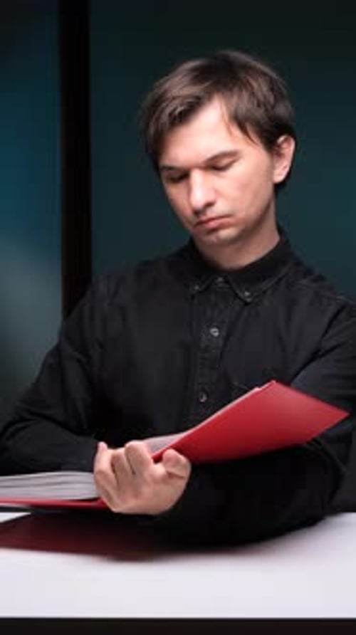 Young Adult Reading with Prayer Beads in Hand