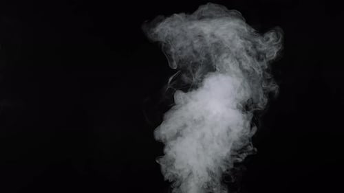 Billowing White Smoke Rising on a Black Background