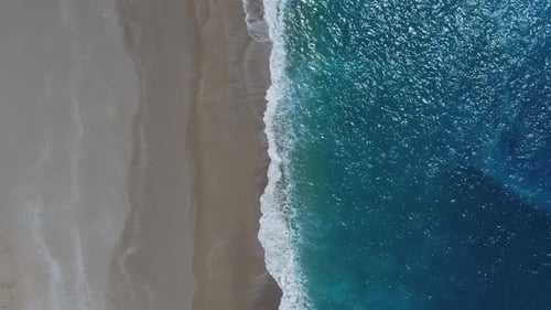 Top View Waves on Sandy Beach