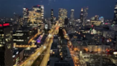 Cityscape Blurred View on a Modern Office Buildings View on a Evening Downtown Through the Window