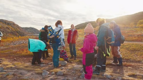 Hikers Walk on the Trail in the Arctic Tundra