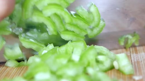 Closeup of Chopping Green Peppers