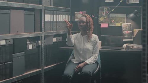 Professional Detective Examining Evidence on Hologram