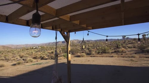 California Desert Rustic Porch with Swinging Edison Bulbs and Hammock, Wide
