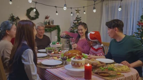 Family Celebrates Christmas with Festive Meal at Home