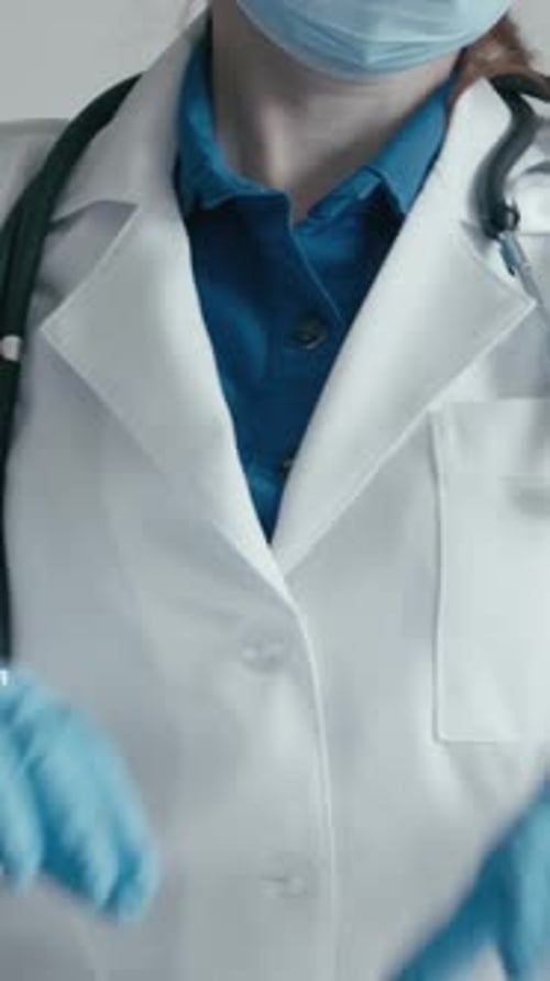 Medical Professional Makes Heart Shape with Hands