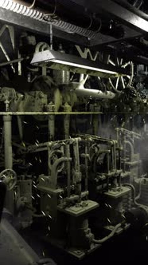 Engine Room Filled with Machinery and Shadows Creating a Mysterious Atmosphere