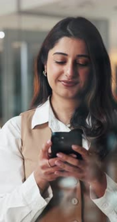 Night, happy woman and typing with phone in office for text message, social media and communication