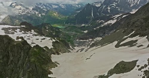 Ancient Snow Glacier Among High Mountains The Peaks of the Mountains are Covered with Snow