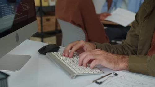 Hands of Man Coding on Computer at Office