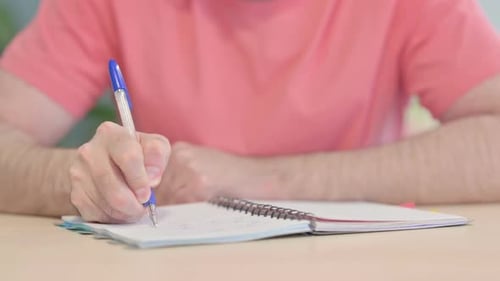 Close up of Man Writing