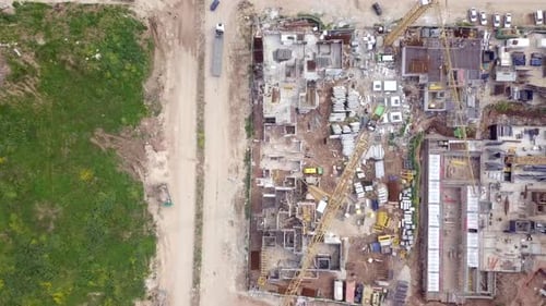 Large residential construction site with cranes, Aerial view