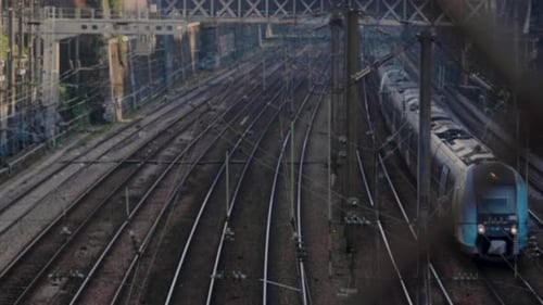 Railway tracks with a moving train in Paris