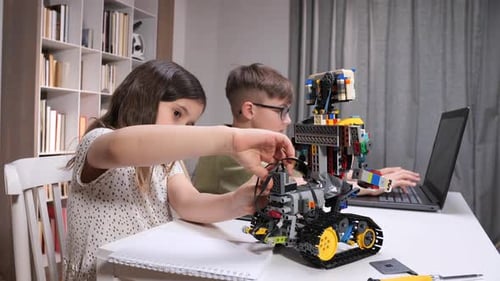 Children Collaborating on a Stem Project Building and Programming a Robot with Building Blocks