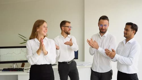 Business Team Celebrates Success in Modern Office