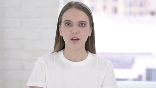 Woman Reacts With Shock and Surprise, Close-Up