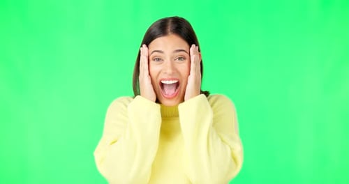 Green screen, surprise and wow face of woman for news, announcement and deal information in studio