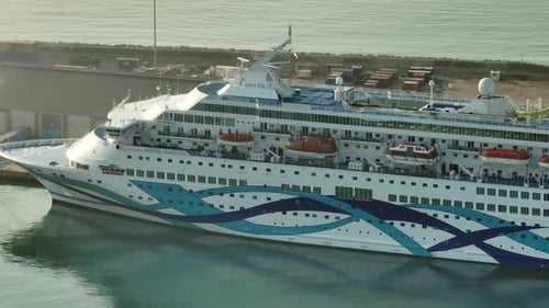 Portside Paradise Aerial Perspective of Luxury Cruise Ship Moored at Island