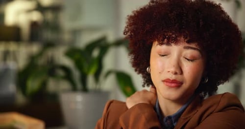 Night, business and woman in office with shoulder pain, overworked and muscle fatigue at computer