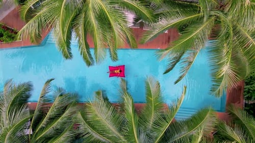 View From Above at a Swimming Pool Couple Men and Women in Swimming Pool Drone View
