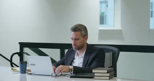 Middle Aged Businessman Working with Laptop in Office Hispanic Business Man Using Laptop Millennial