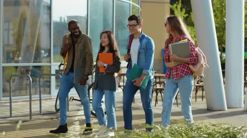 Happy College Students Walking Together on Campus